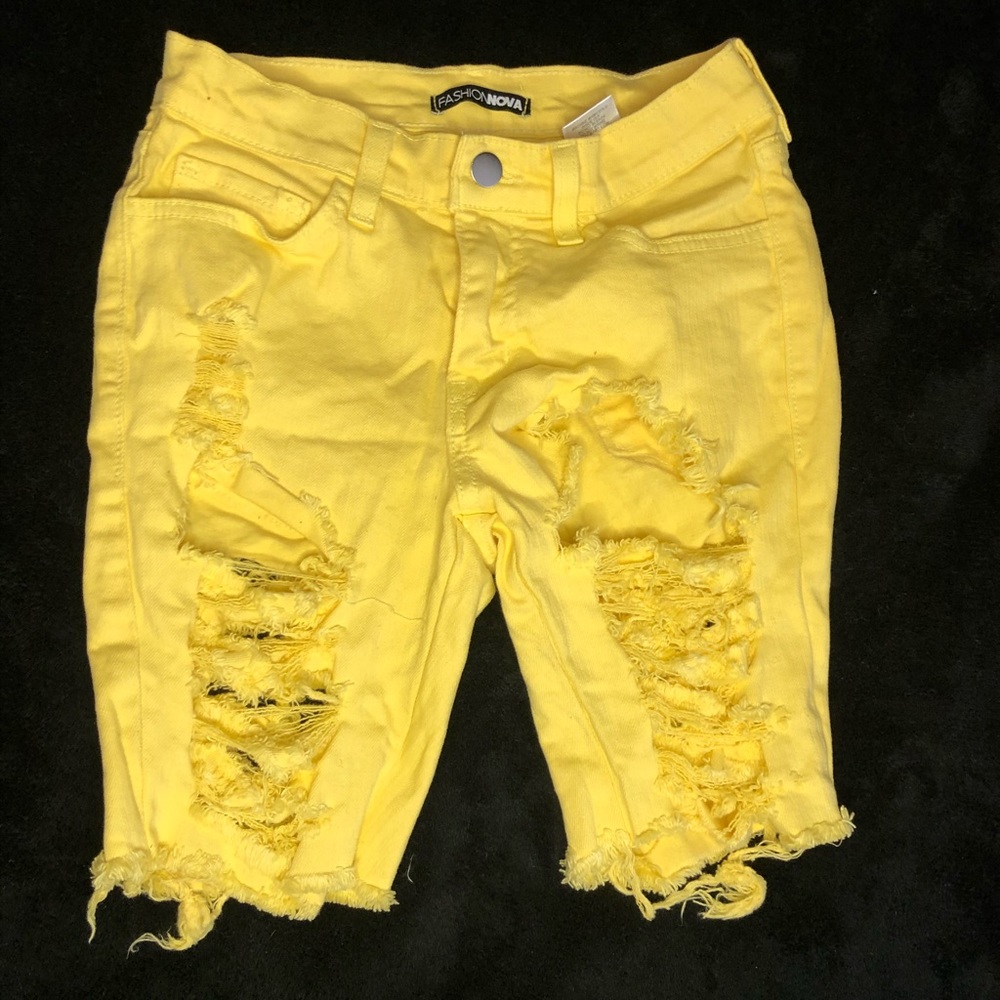 Yellow ripped shorts from Fashion Nova.